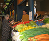 Woman buys vegetables